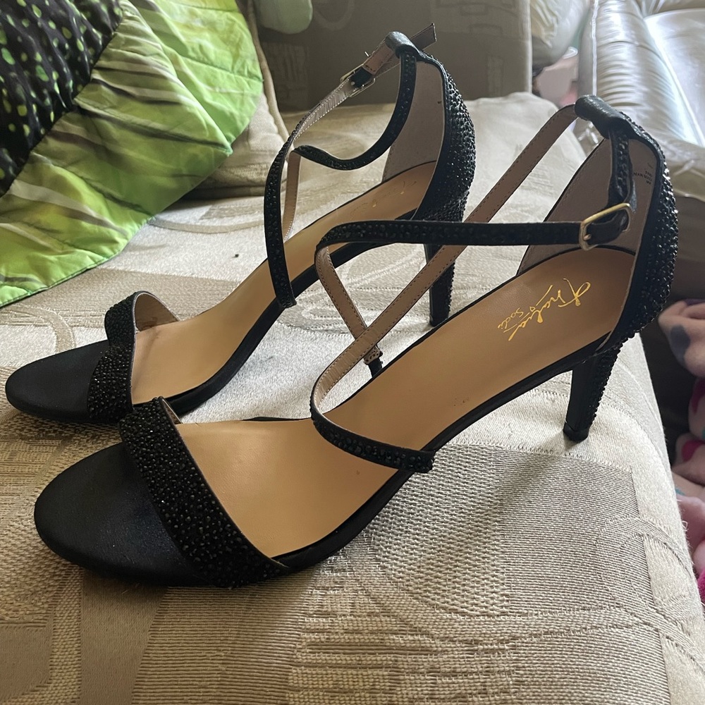Thalia Sodi black gem dinner heels never worn with cross strap.